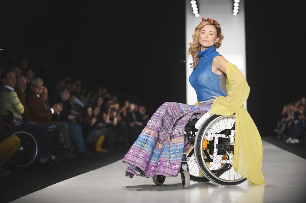 A disabled model displays clothes designed for disabled people during "Space Without Borders" show of a Fashion Week in Moscow on March 31, 2014.   AFP PHOTO / ALEXANDER NEMENOV        (Photo credit should read ALEXANDER NEMENOV/AFP/Getty Images)